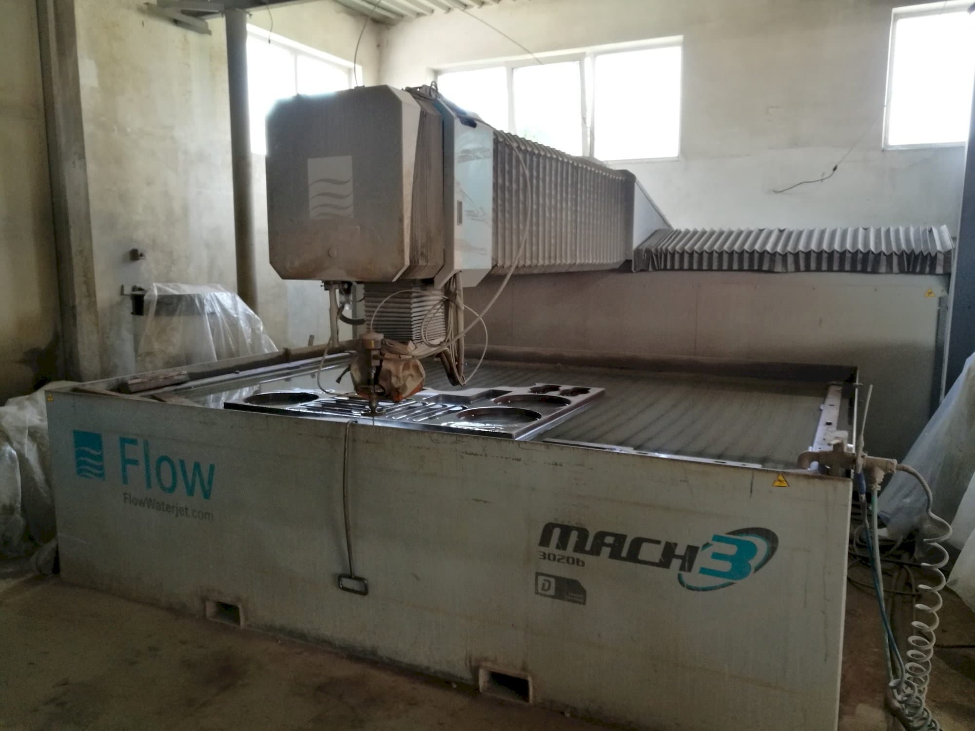 Front view of Flow Mach3-3020b machine
