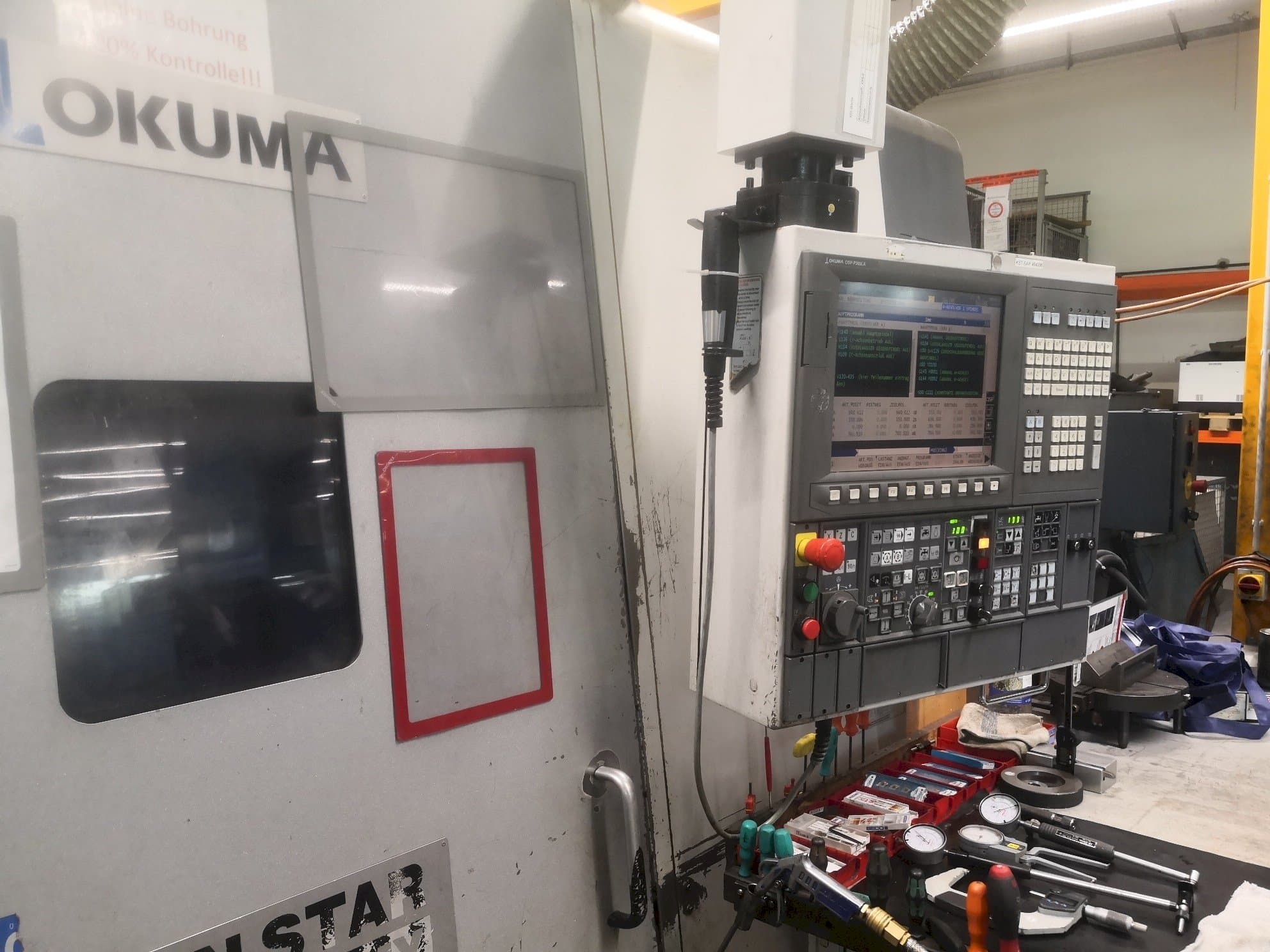 Front view of Okuma LT 300 MY machine