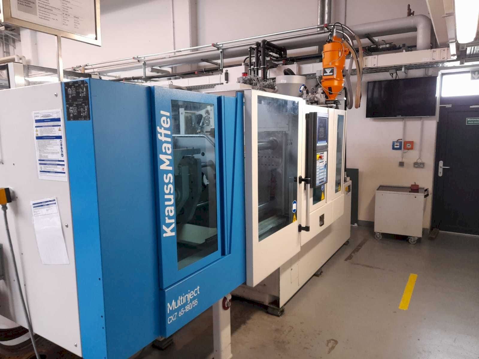Front view of Krauss Maffei KM 65/80 CX  machine