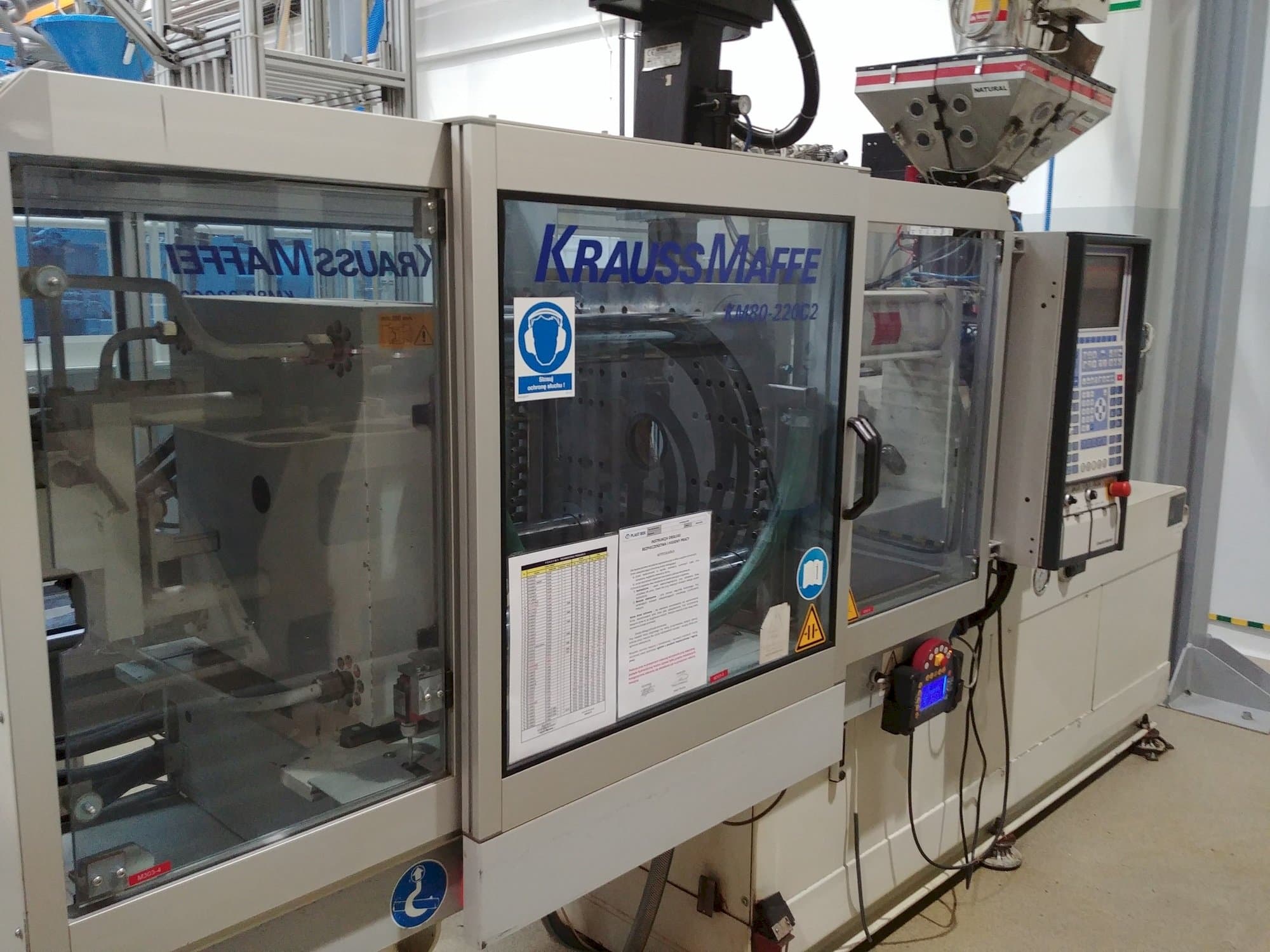 Left view of Krauss Maffei KM 80-220 C machine