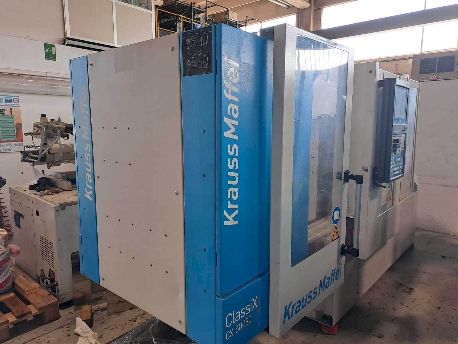 Left view of Krauss Maffei 50-180CX  machine