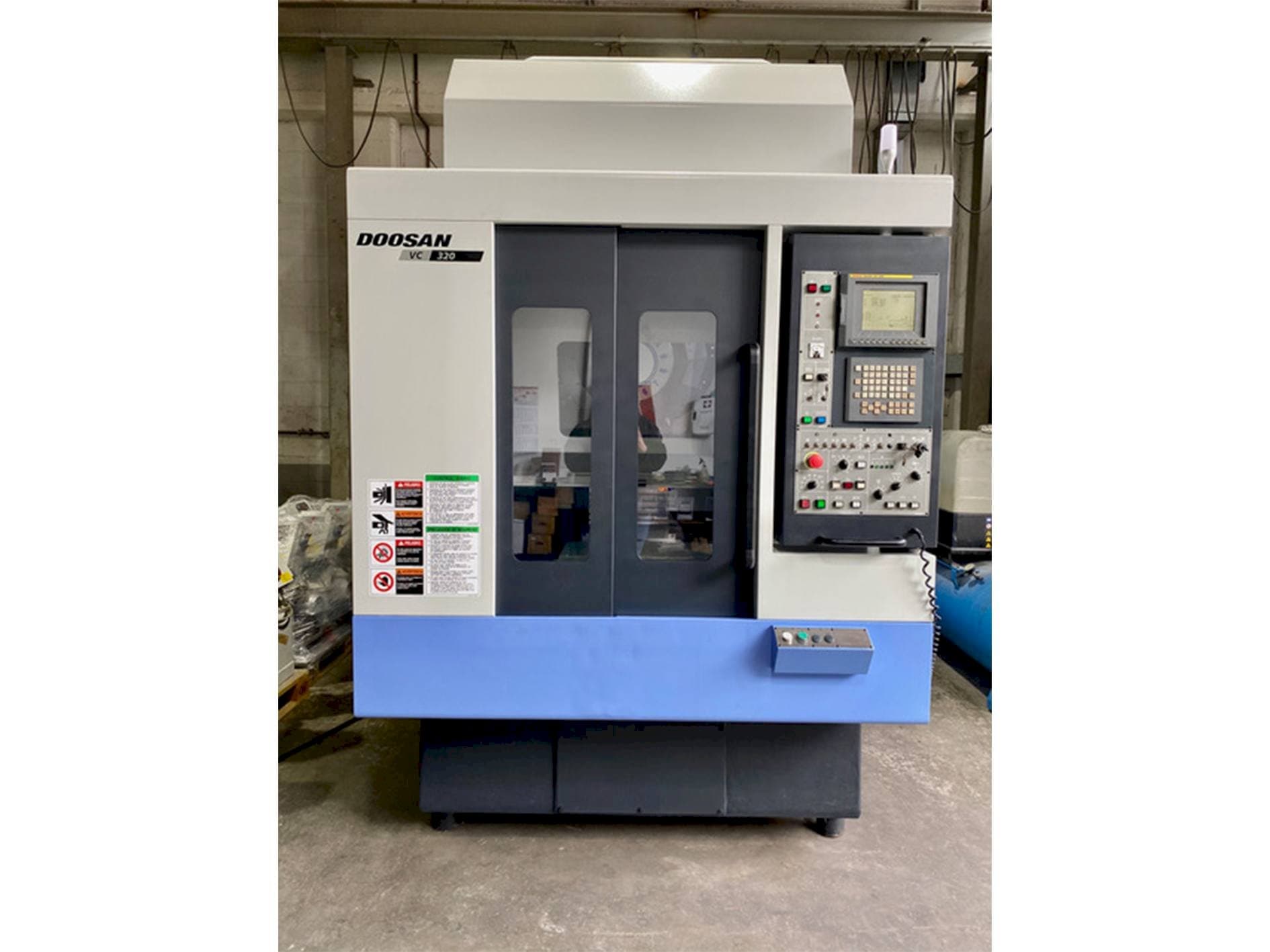 Front view of Doosan VC 320 machine