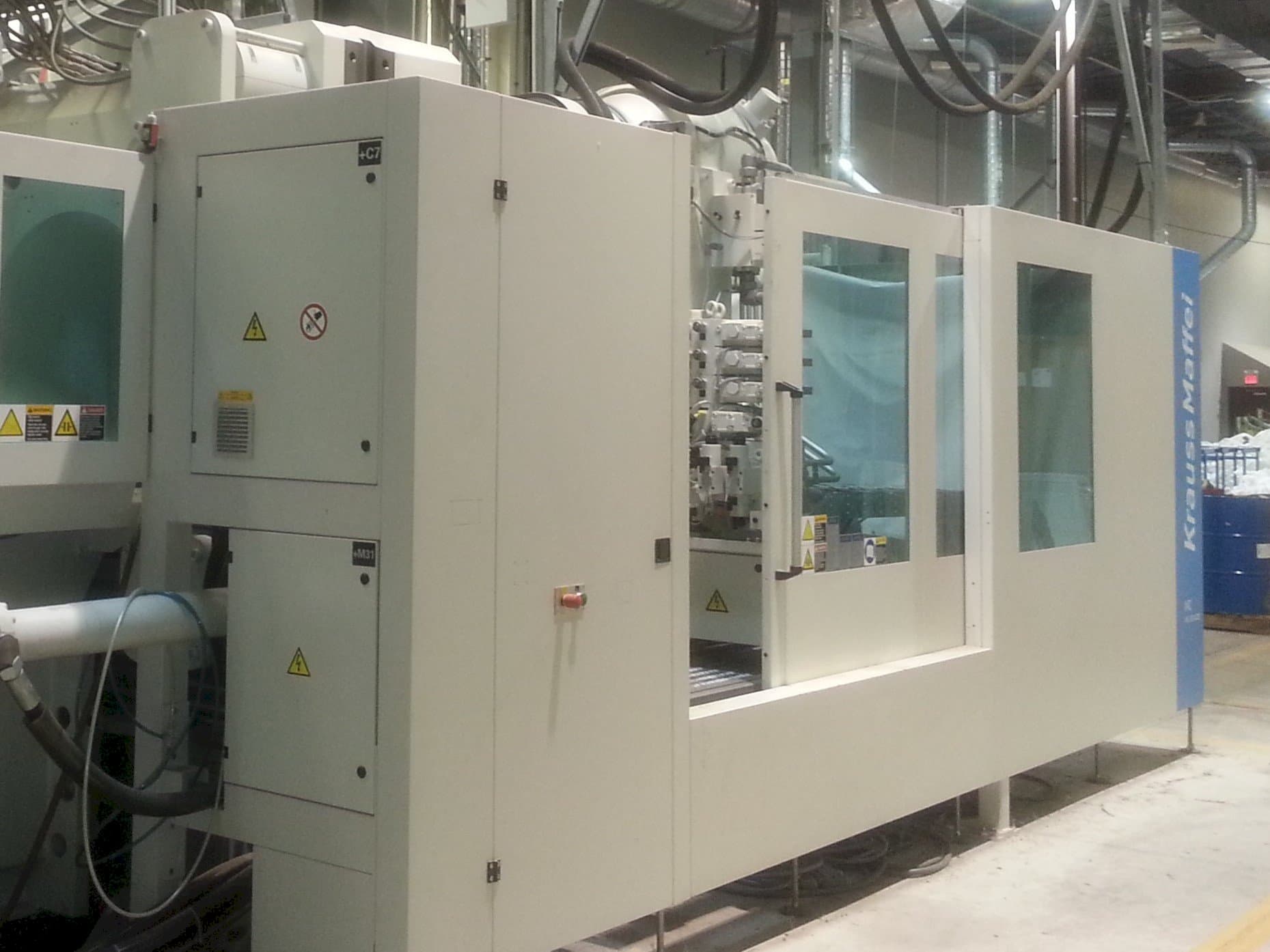 Front view of Krauss Maffei 1300-14000 MX IMC machine