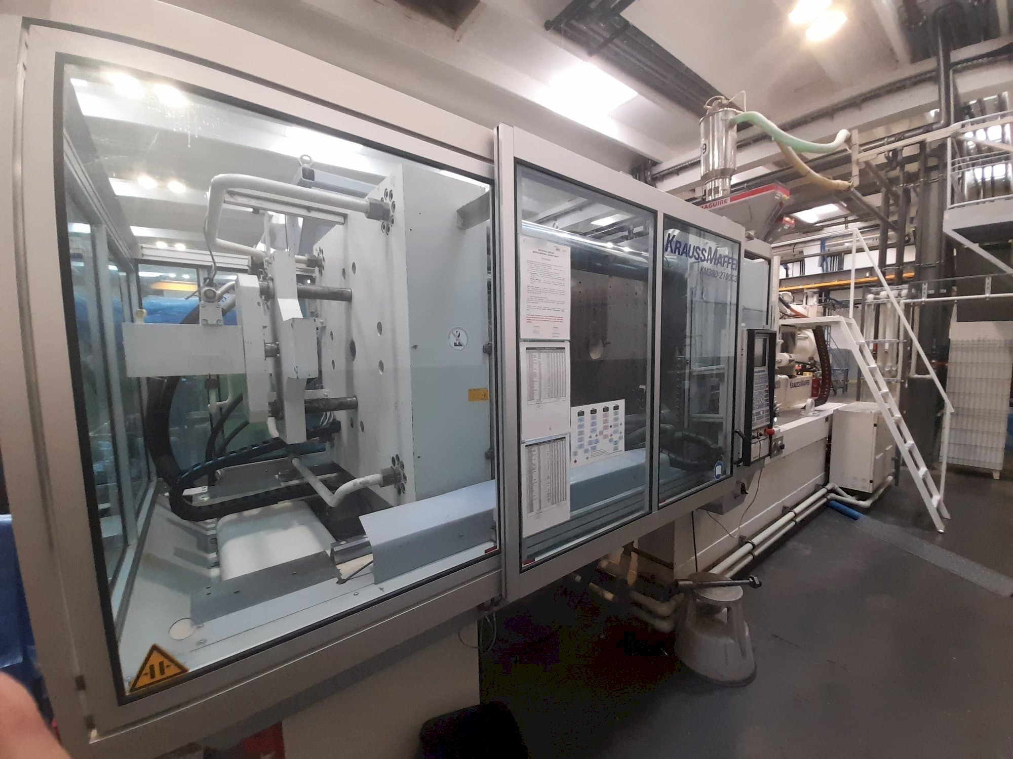 Left side view of Krauss Maffei 380-2700 C3  machine