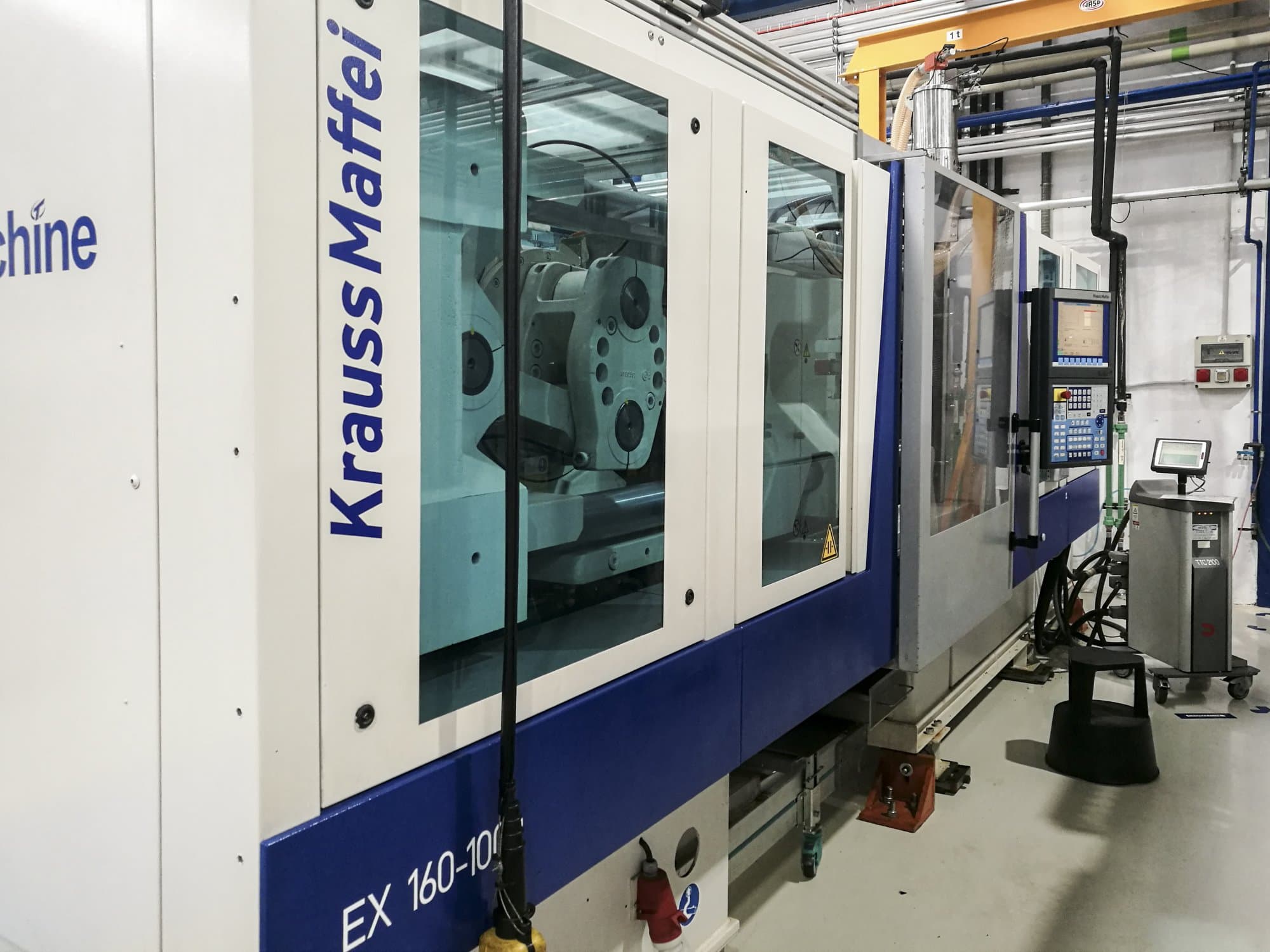 Left view of Krauss Maffei 160-1000 EX Machine