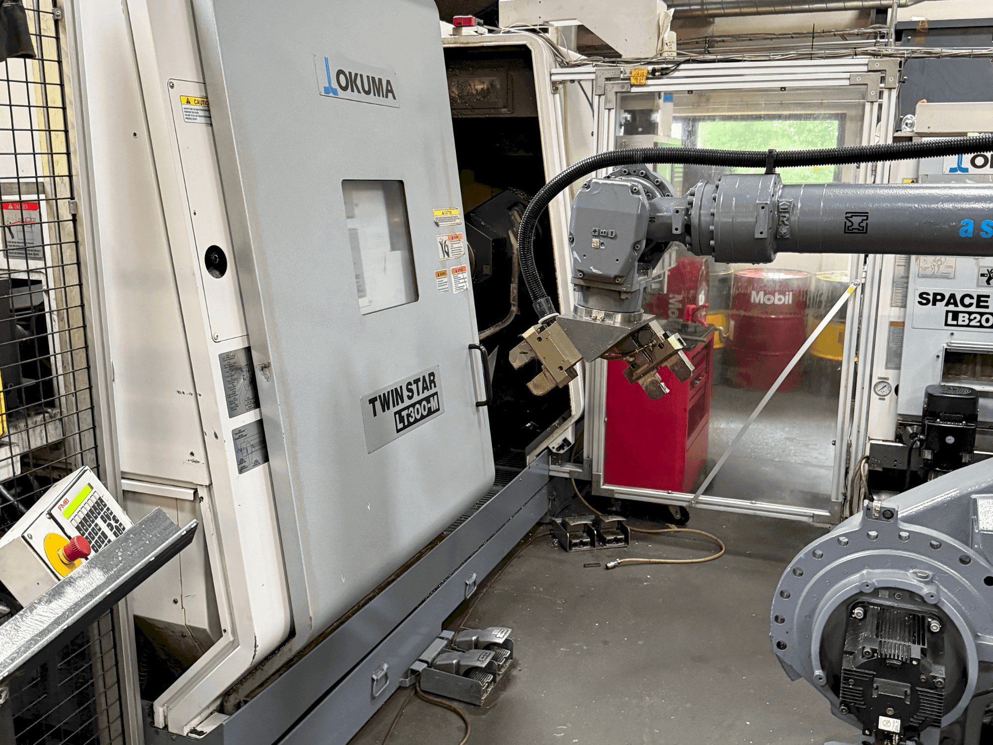 Front view of Okuma Twinstar LT300-M machine