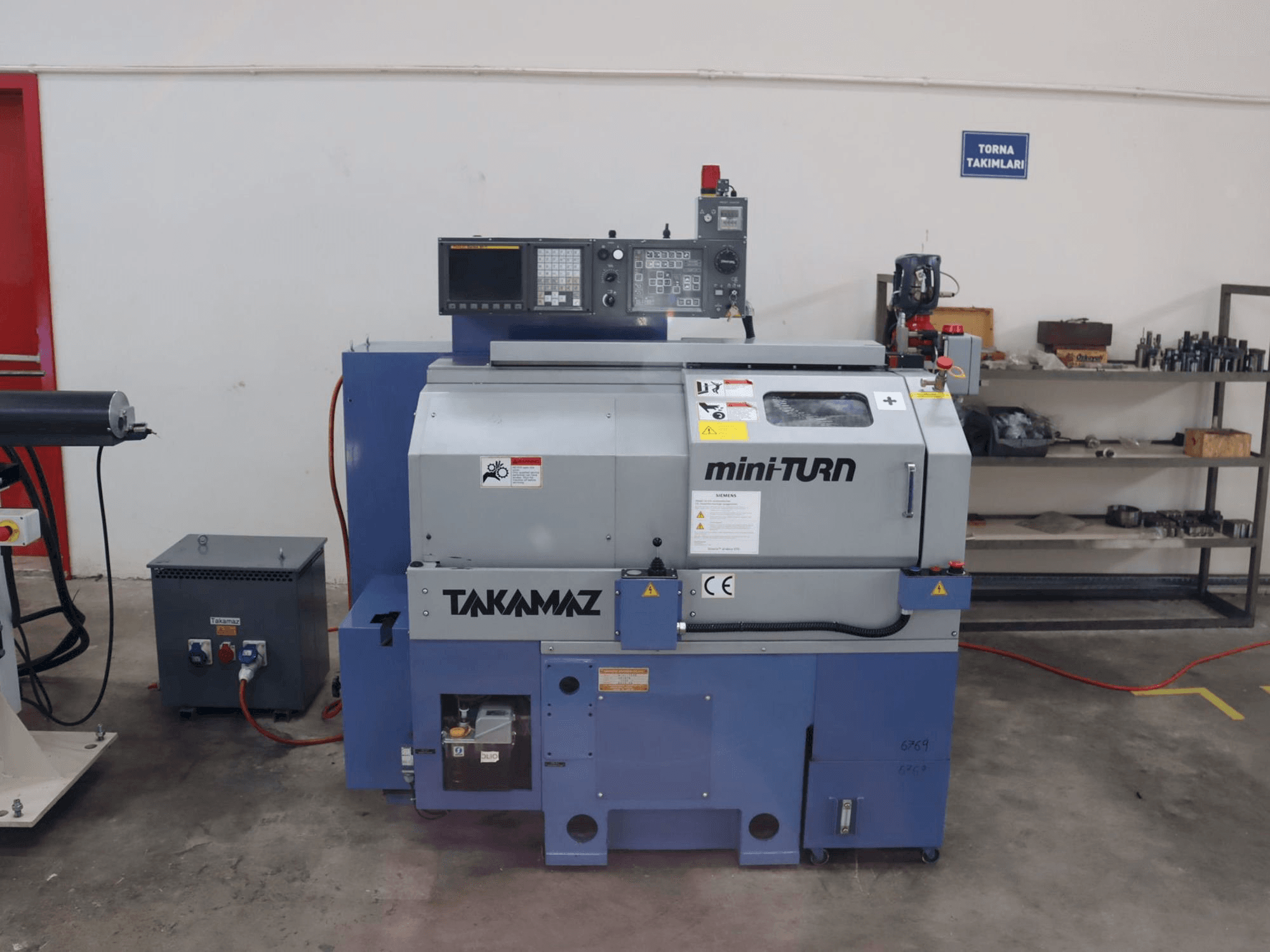 Front view of Takamaz mini-TURN machine