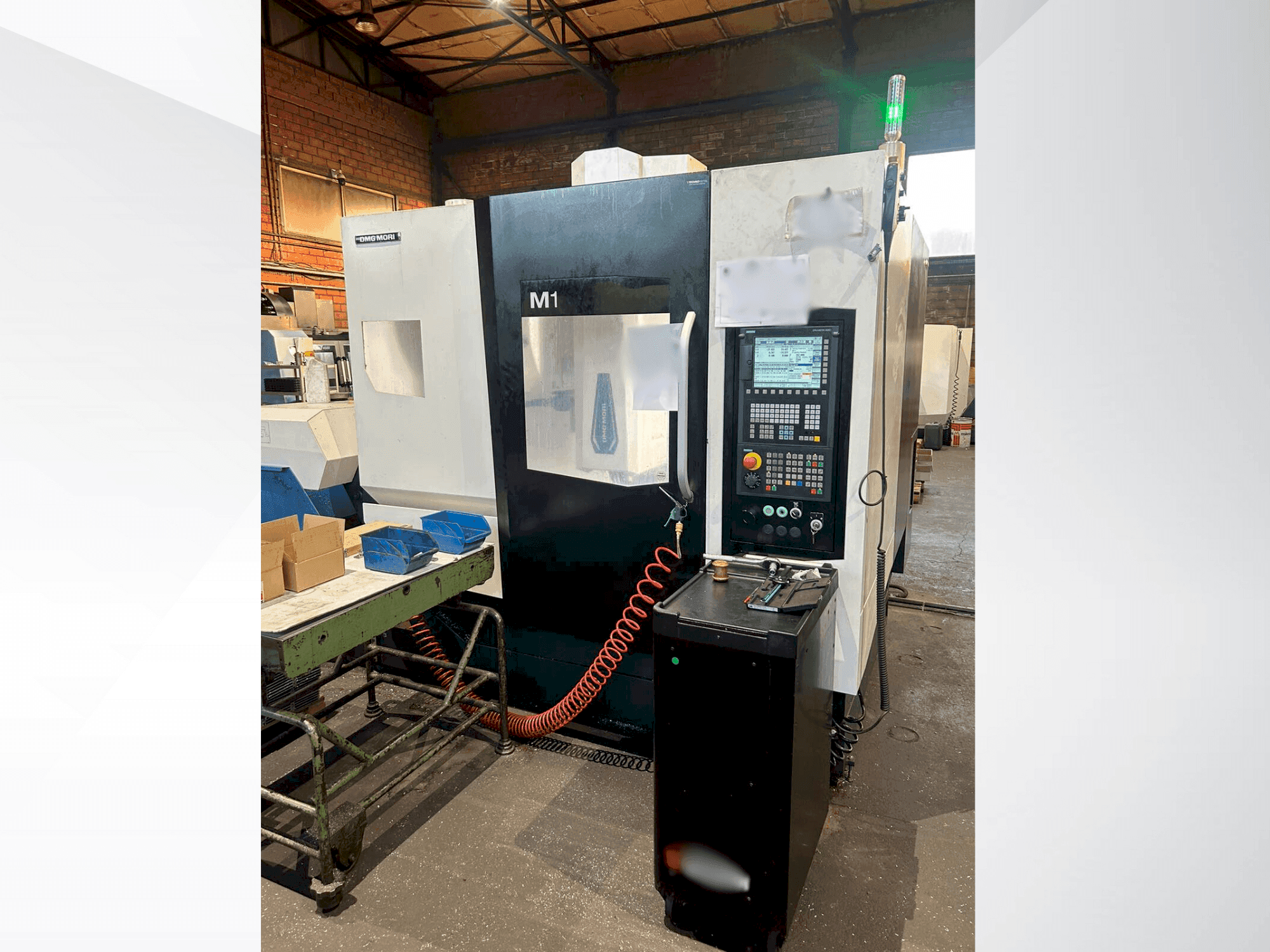 Front view of DMG MORI M1 PRO machine