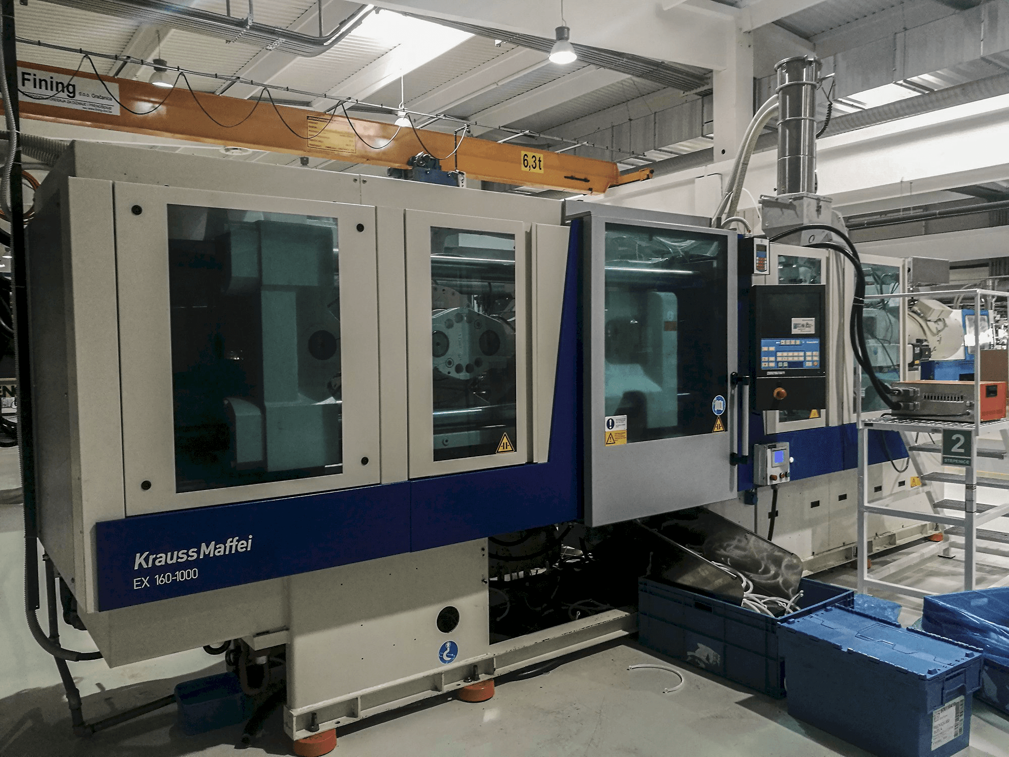 Left view of Krauss Maffei 160-1000 EX Machine