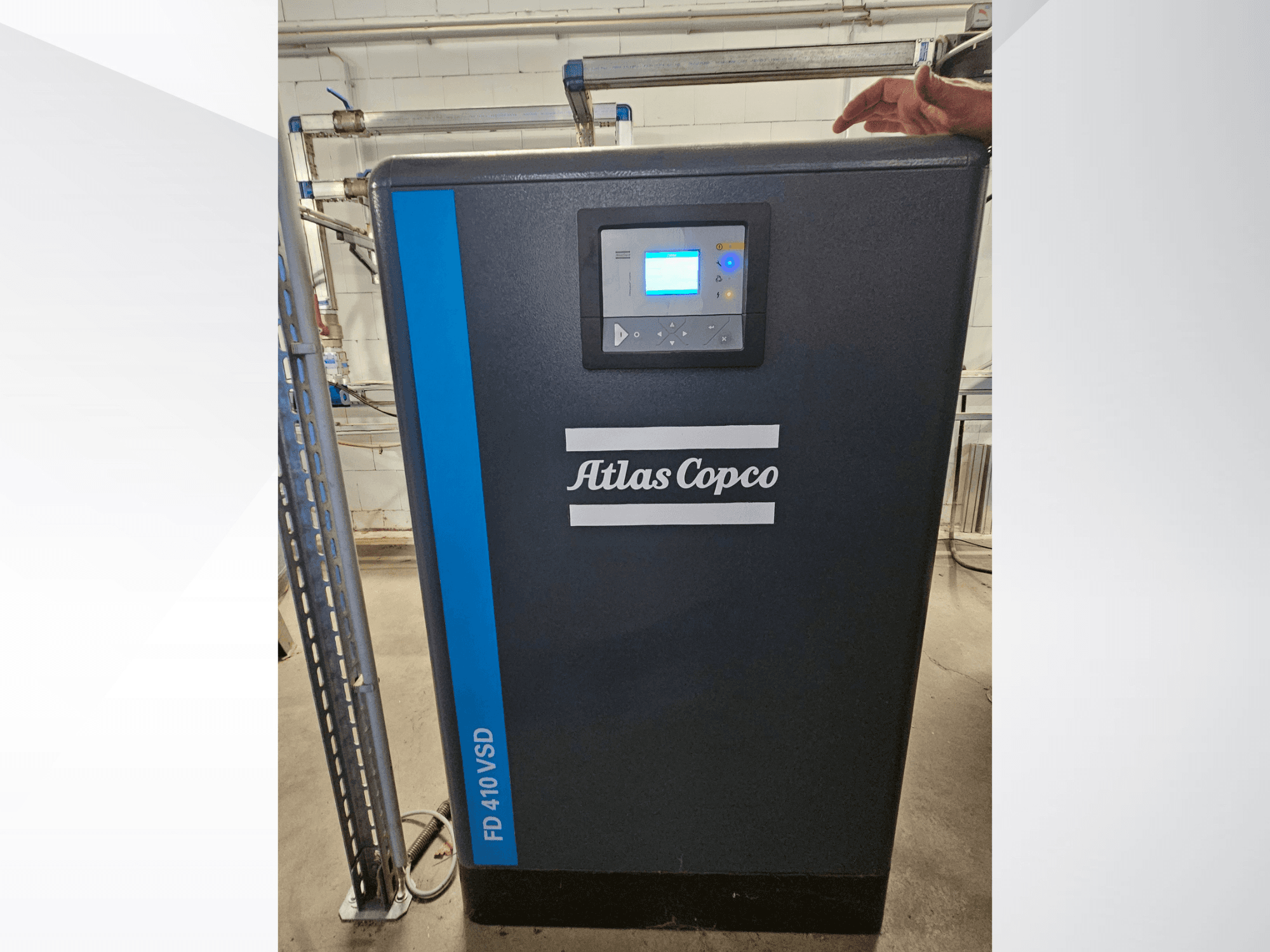 Atlas Copco GA 110 VSD+ air compressor in a front view, featuring a digital display and blue accents for easy identification.