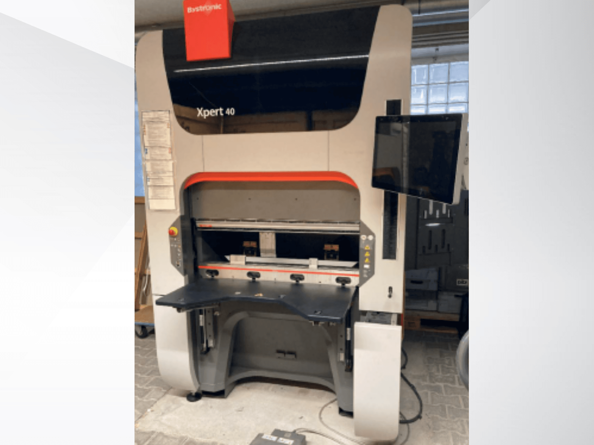Bystronic Xpert 40/1030 press brake, front view, featuring control buttons and a display screen on the side.