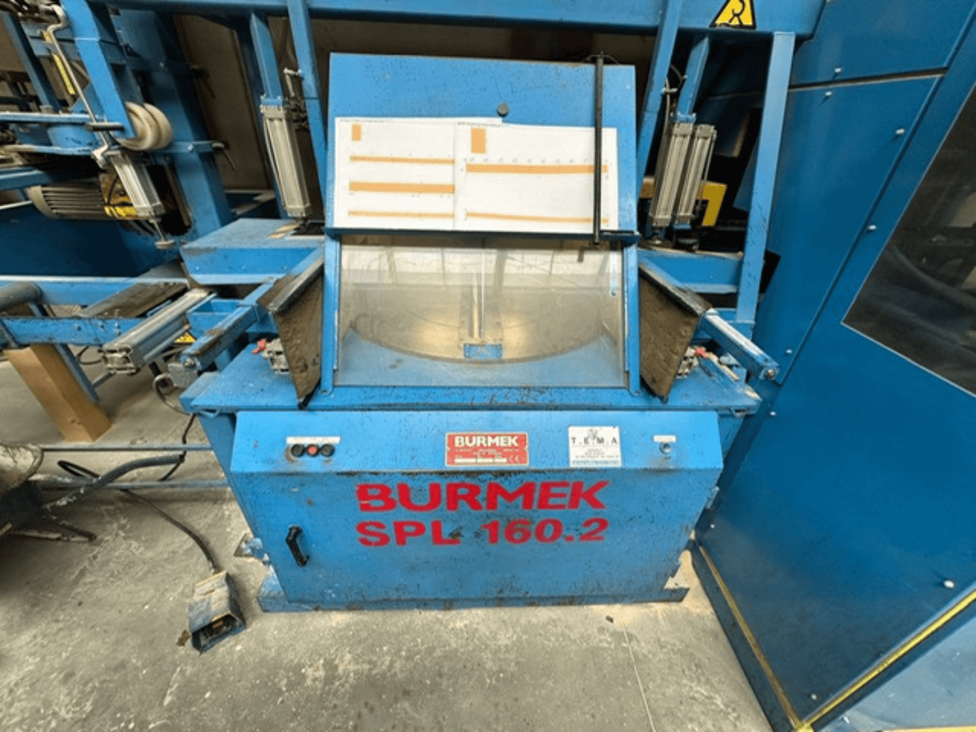 Blue BURMEK SPL 160.2 wood machine, front view, featuring control buttons and a glass panel showcasing the interior.