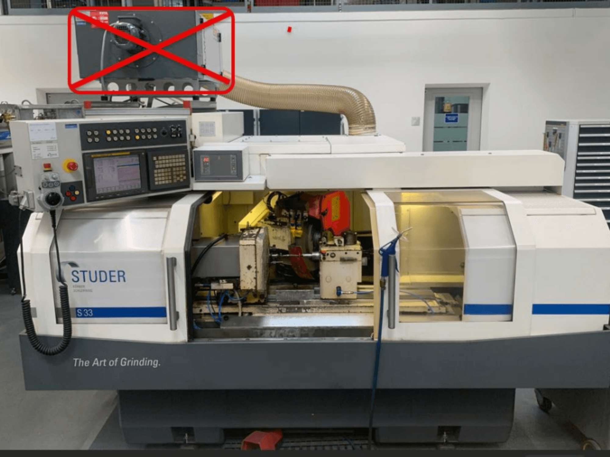 Studer S33 cylindrical grinding machine, front view showing control panel and grinding components with visible electrical connections.