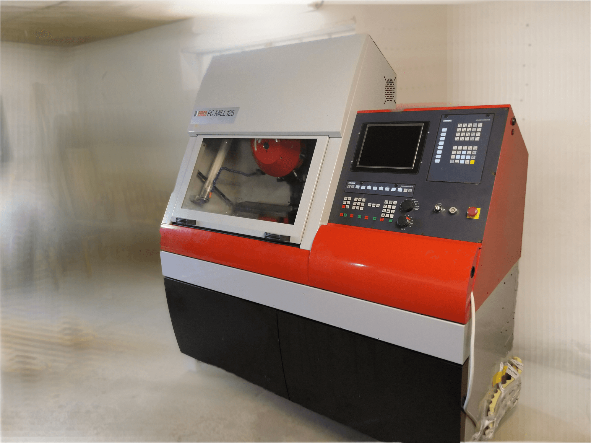 EMCO PC MILL 125 vertical machining centre, front view with control panel and visible machining area.