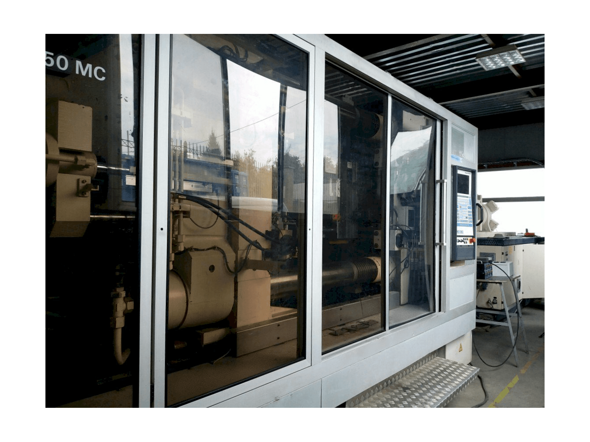 Front view of Krauss Maffei KM 800/1330 MC machine