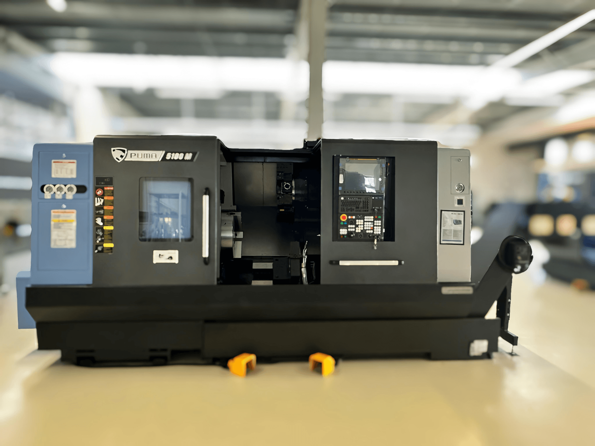Front view of DN SOLUTIONS PUMA 5100 MB Turn-Mill Centre, showcasing control panel and machining area.