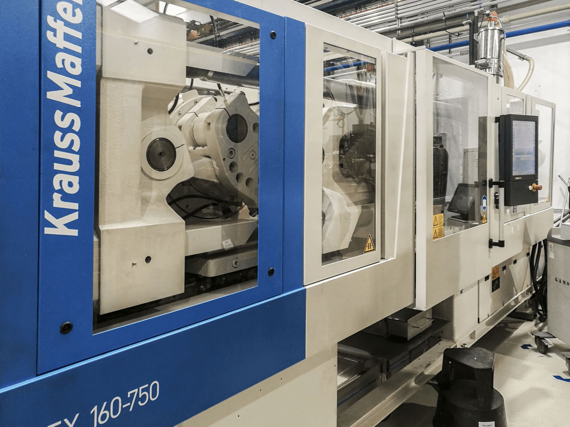 Left view of Krauss Maffei 160-750 EX Machine