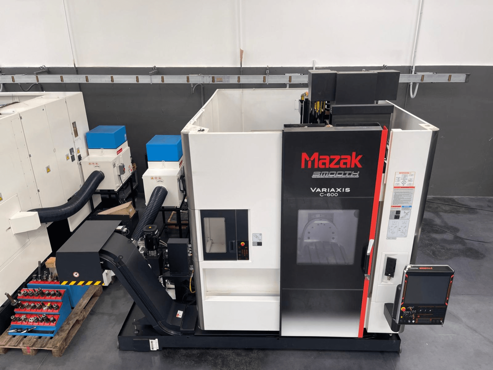 Mazak VARIAXIS C 600 vertical machining center, front view showcasing control panel and tool storage.