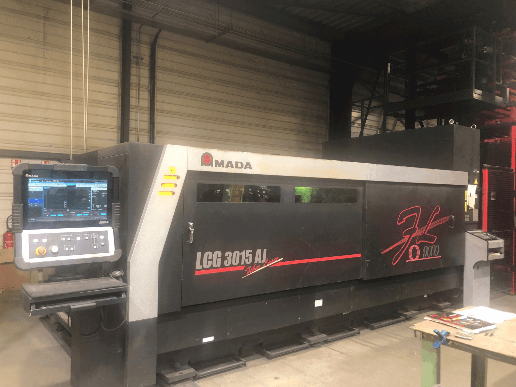 Front view of AMADA LCG-3015AJ 9kw + ASLUL TWIN TOWER machine