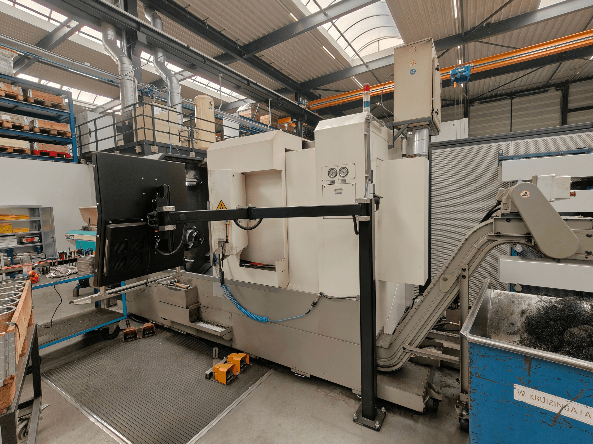 Victor Vturn A26 horizontal turning machine, side view, featuring control panel, chip conveyor, and industrial workspace.