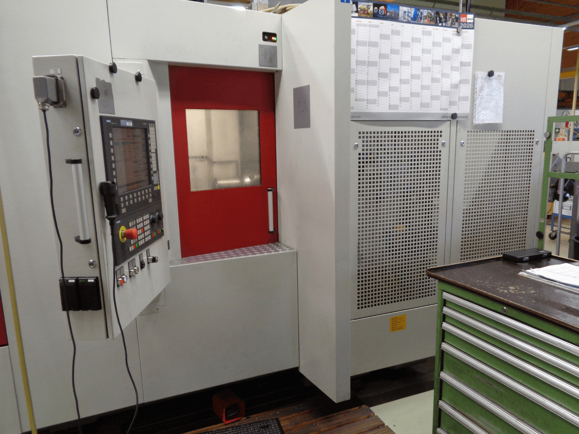 Starrag Heckert HEC 400 D Horizontal Machining Centre, side view, featuring control panel and access door with red trim.