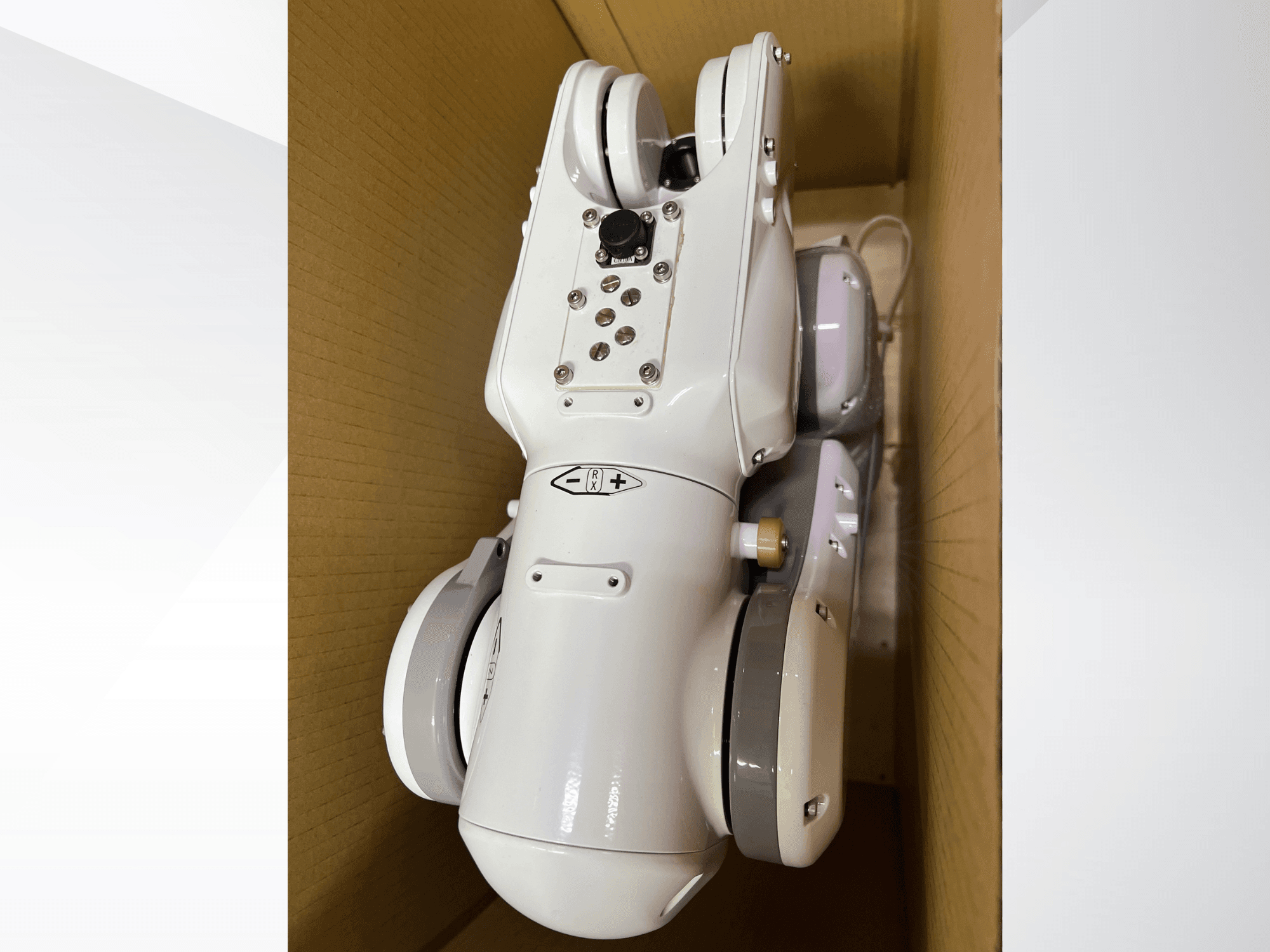 NACHI MZ04D robot arm viewed from the top, showcasing its sleek white design and control panel with buttons and indicators.