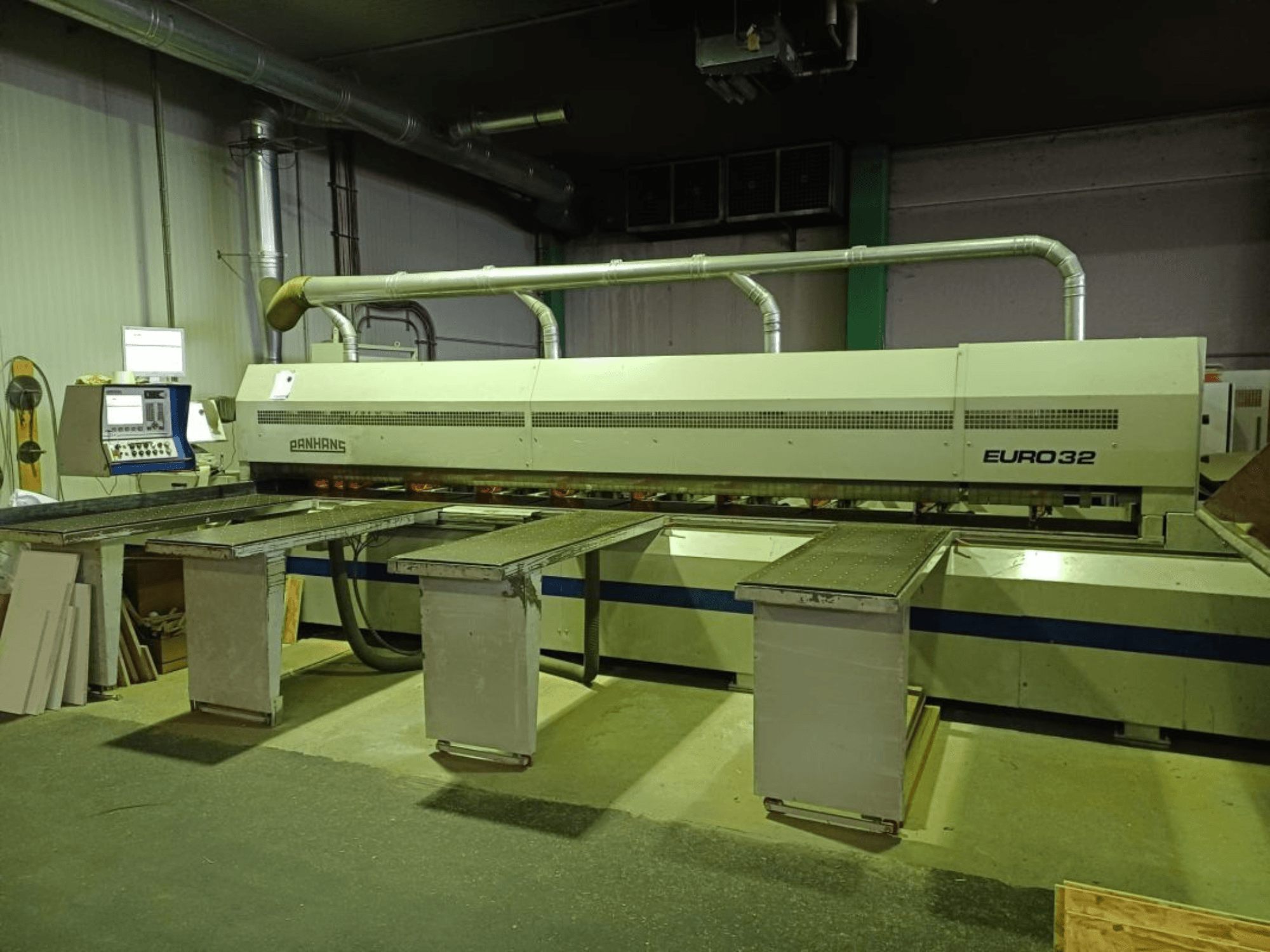 Alt text: Front view of PANHANS EURO 32 panel saw, featuring adjustable tables and control panel in an industrial setting.
