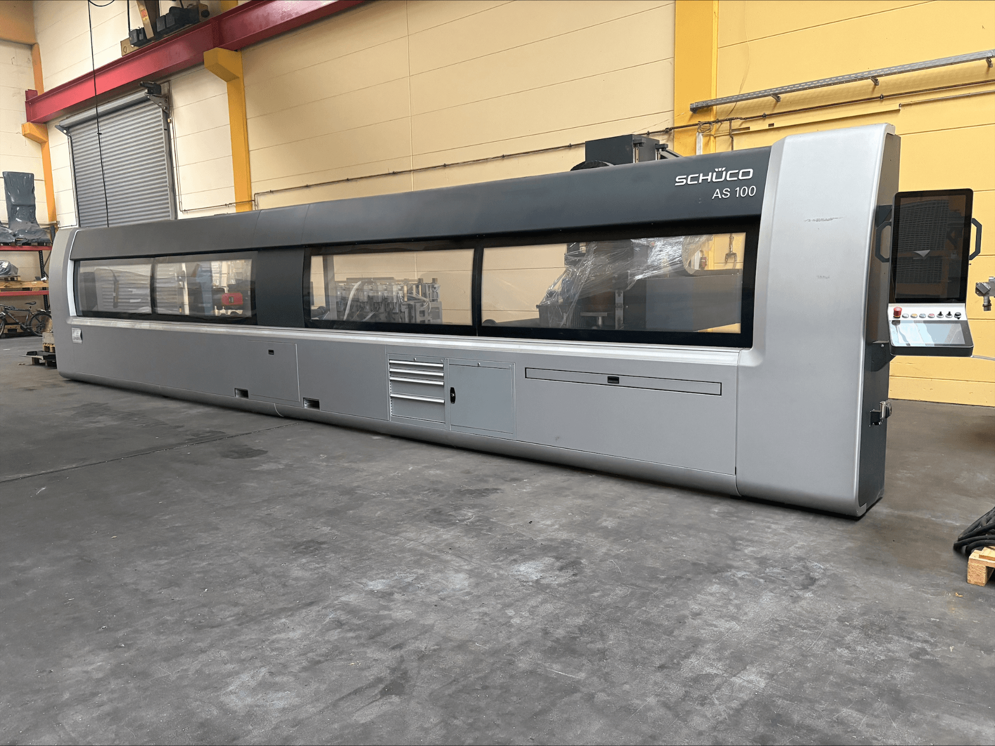 SCHÜCO AS 100 Universal Machining Centre, front view showing large window panel and control interface.