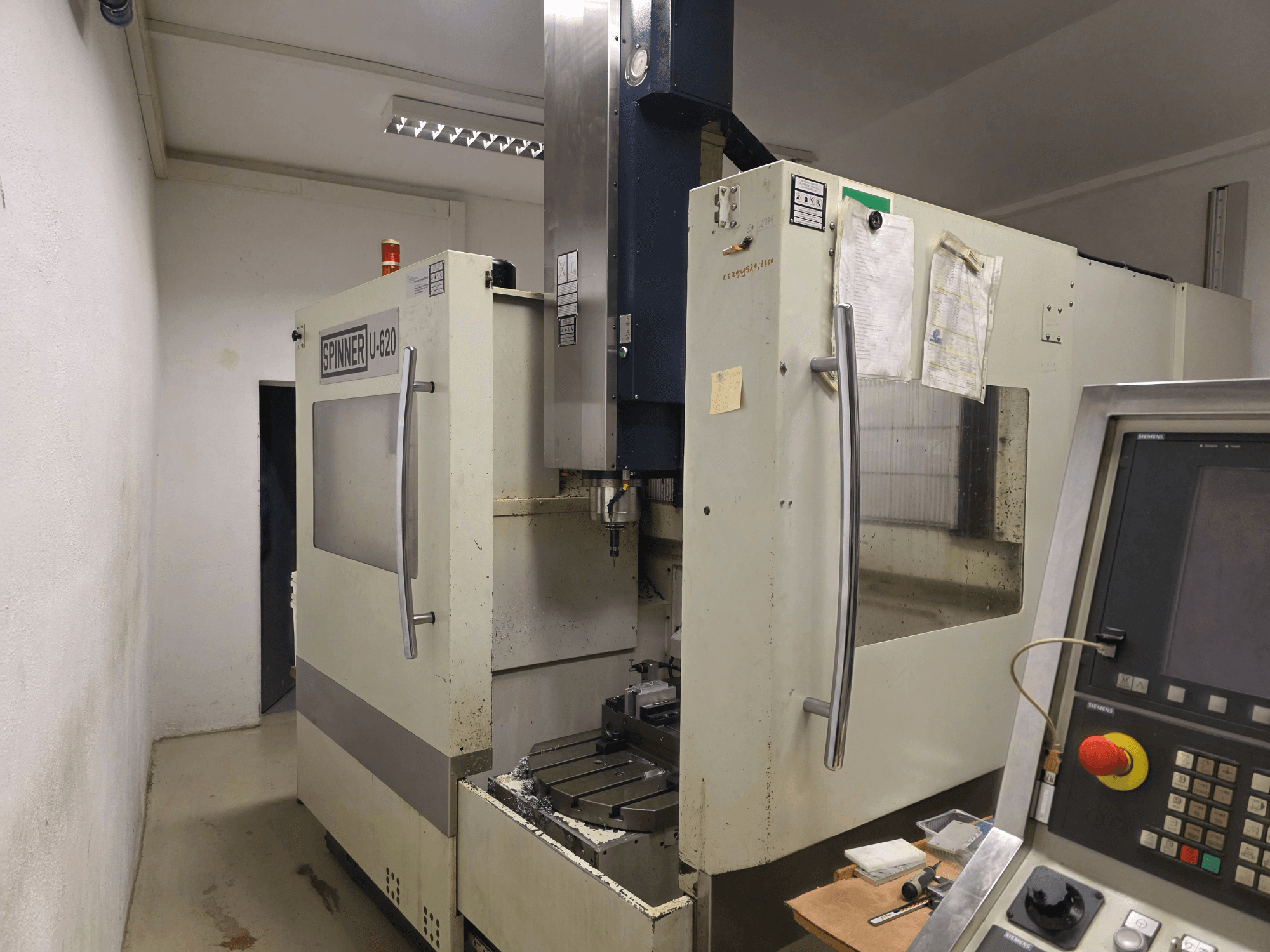 Vertical Machining Centre SPINNER U5-620 in a workshop, front view, showing control panel and work table.