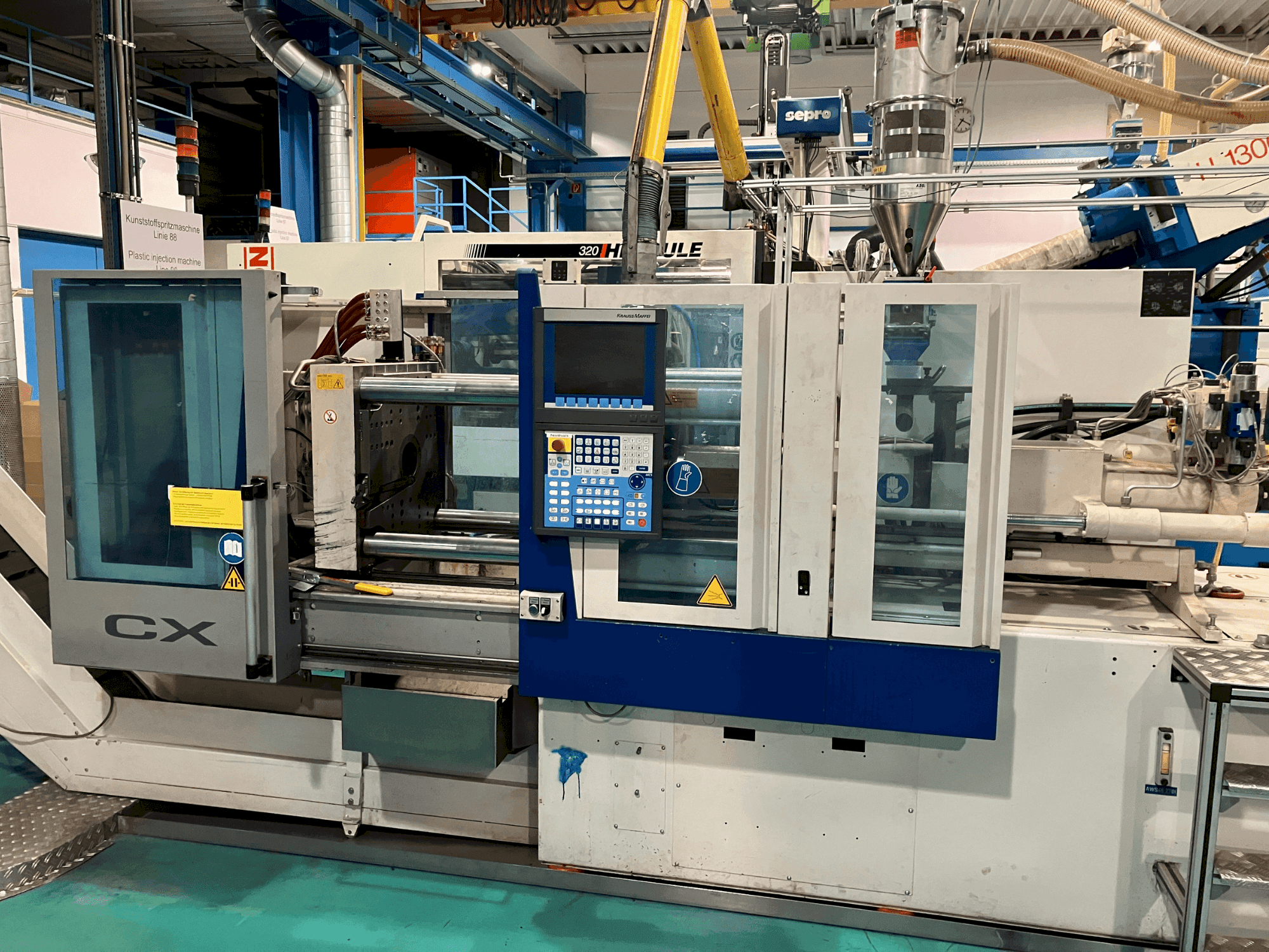 Front view of Krauss Maffei 65-180 CX machine