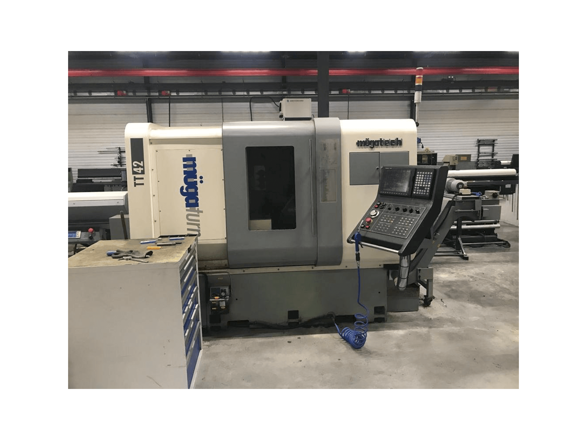 Front view of Muga TT-42 machine