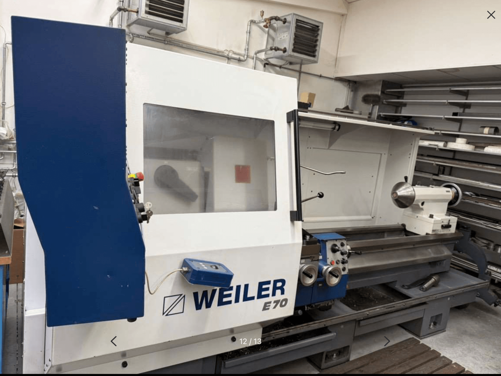 Weiler E70 horizontal turning machine, side view showing controls and spindle; robust design visible in a workshop setting.