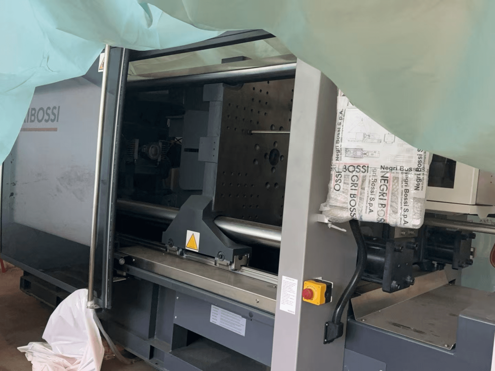 Negri Bossi NOVA e350T H1550 electrical injection moulding machine, side view, showing open door and internal components.