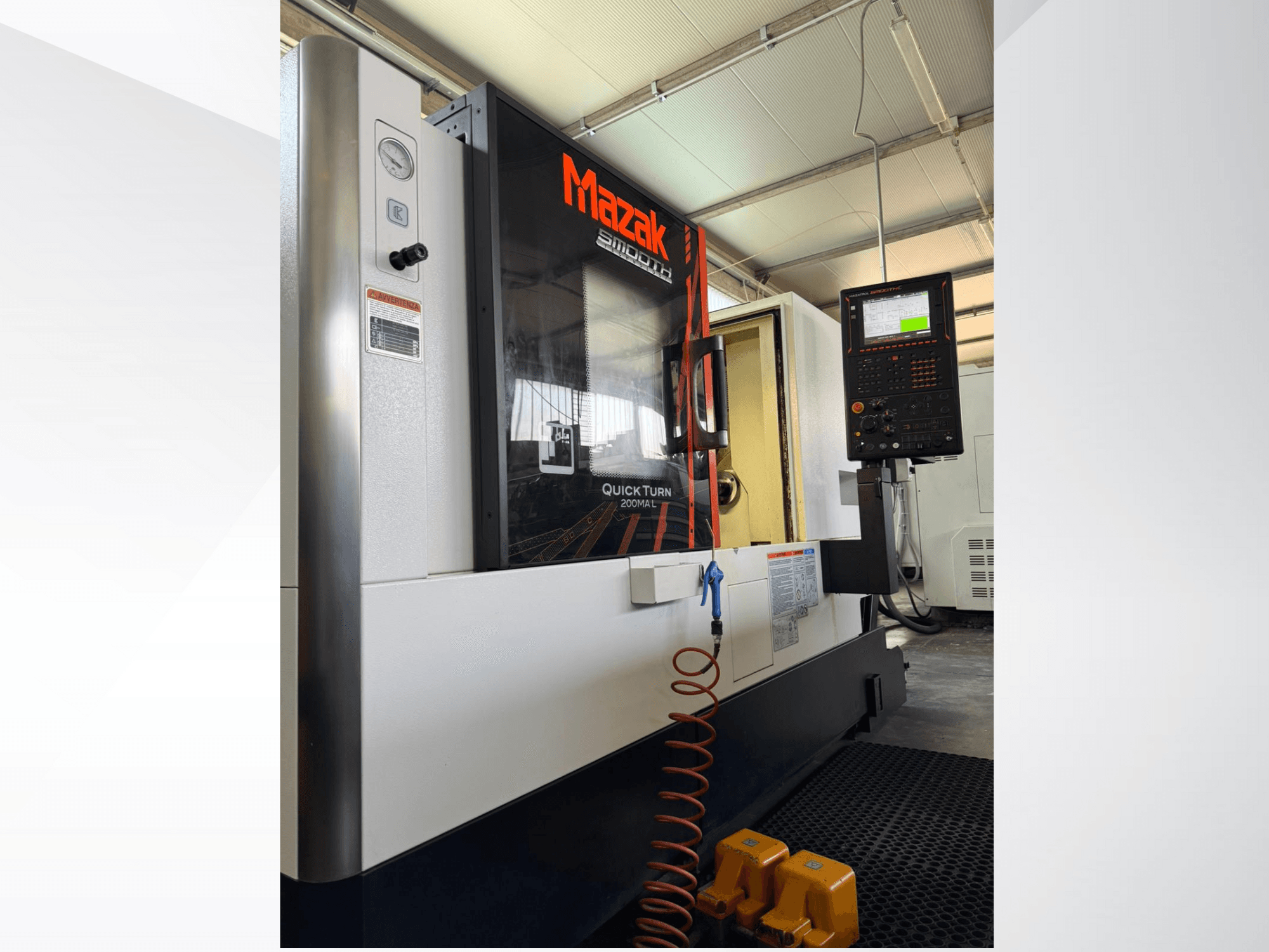 Mazak Quick Turn CNC lathe in grey and black, side view showing control panel and pressure gauge. Ideal for precision machining.