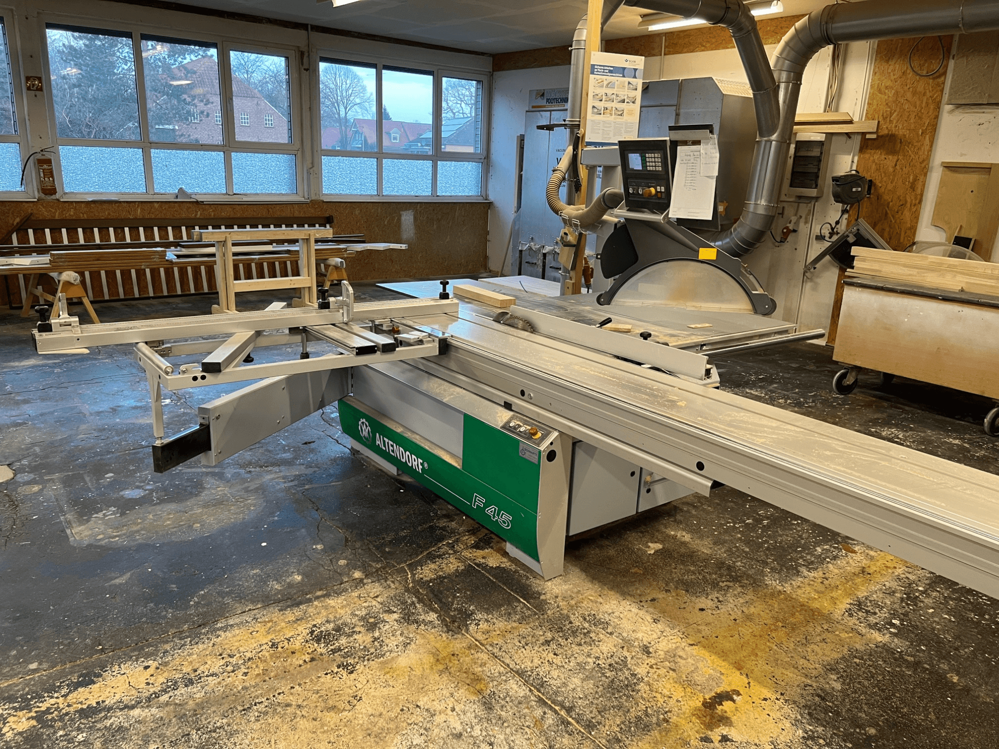 Altendorf F45 table saw in a workshop, front view showing adjustable arm and control panel, ideal for precision cutting tasks.