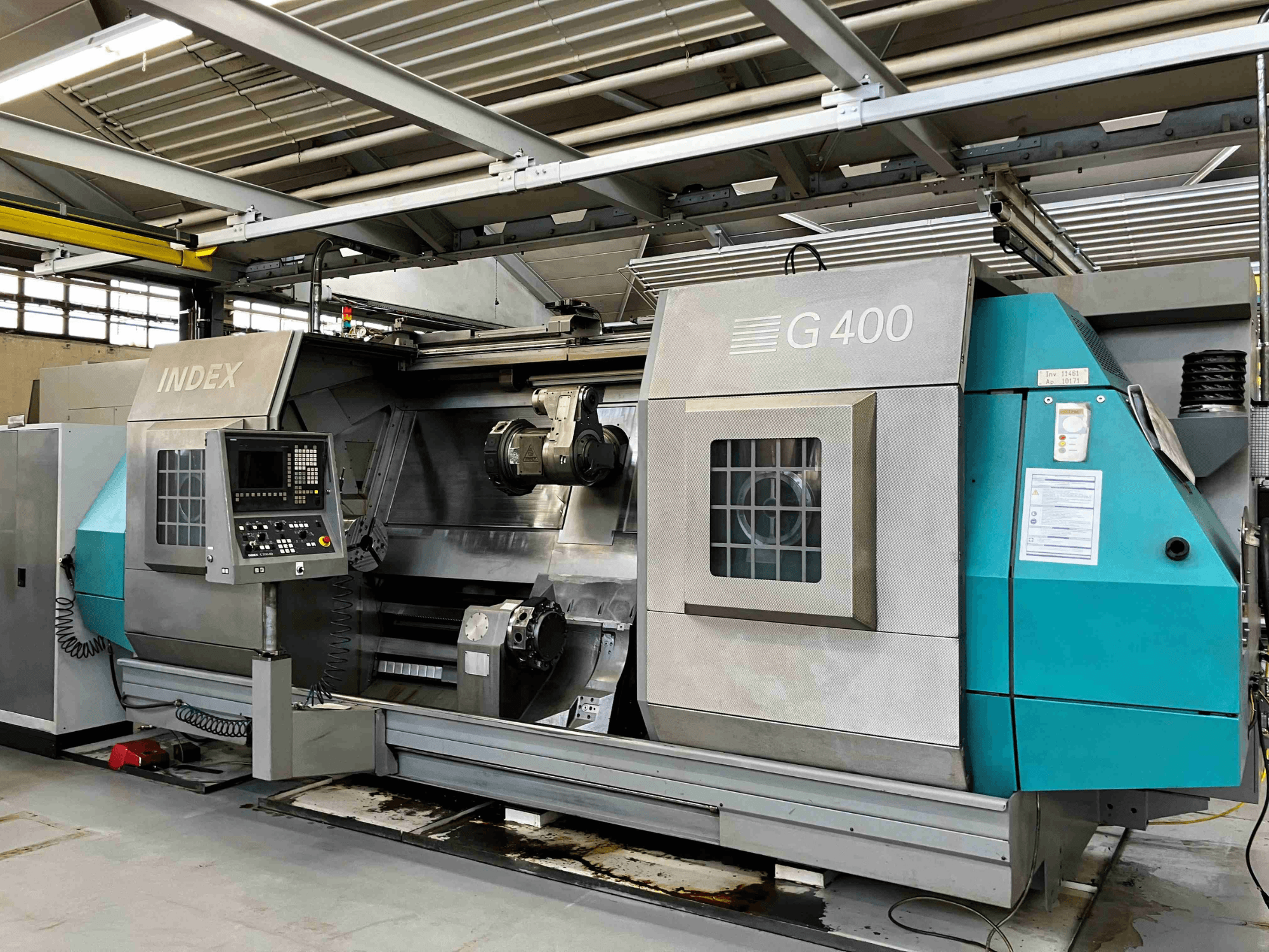 INDEX G400 CNC lathe machine, front view, featuring control panel with numeric display and dual spindle for precision machining.
