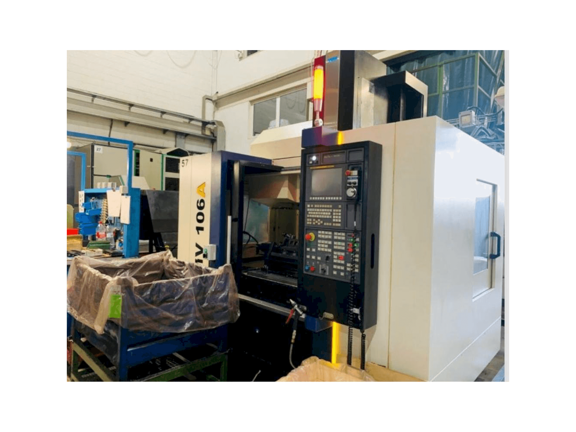 Front view of YCM NMV106A machine