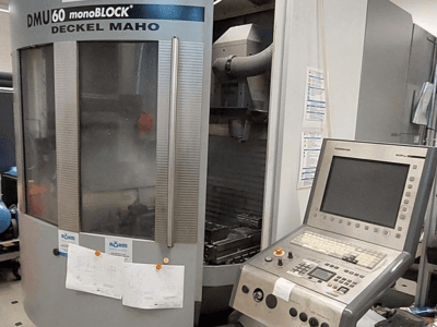 DMU 60 monoBLOCK by Deckel Maho, front view of a CNC milling machine with a control panel and technical drawings attached.