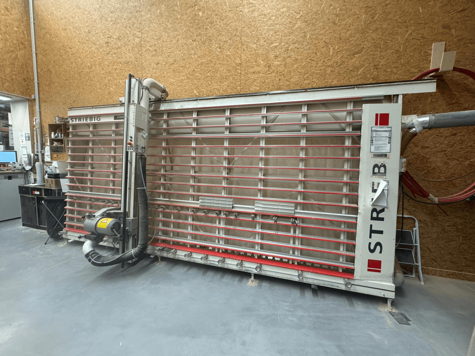 STRIEBIG contour saw with a large vertical blade, side view showing dust extraction and control panel. Ideal for woodworking.