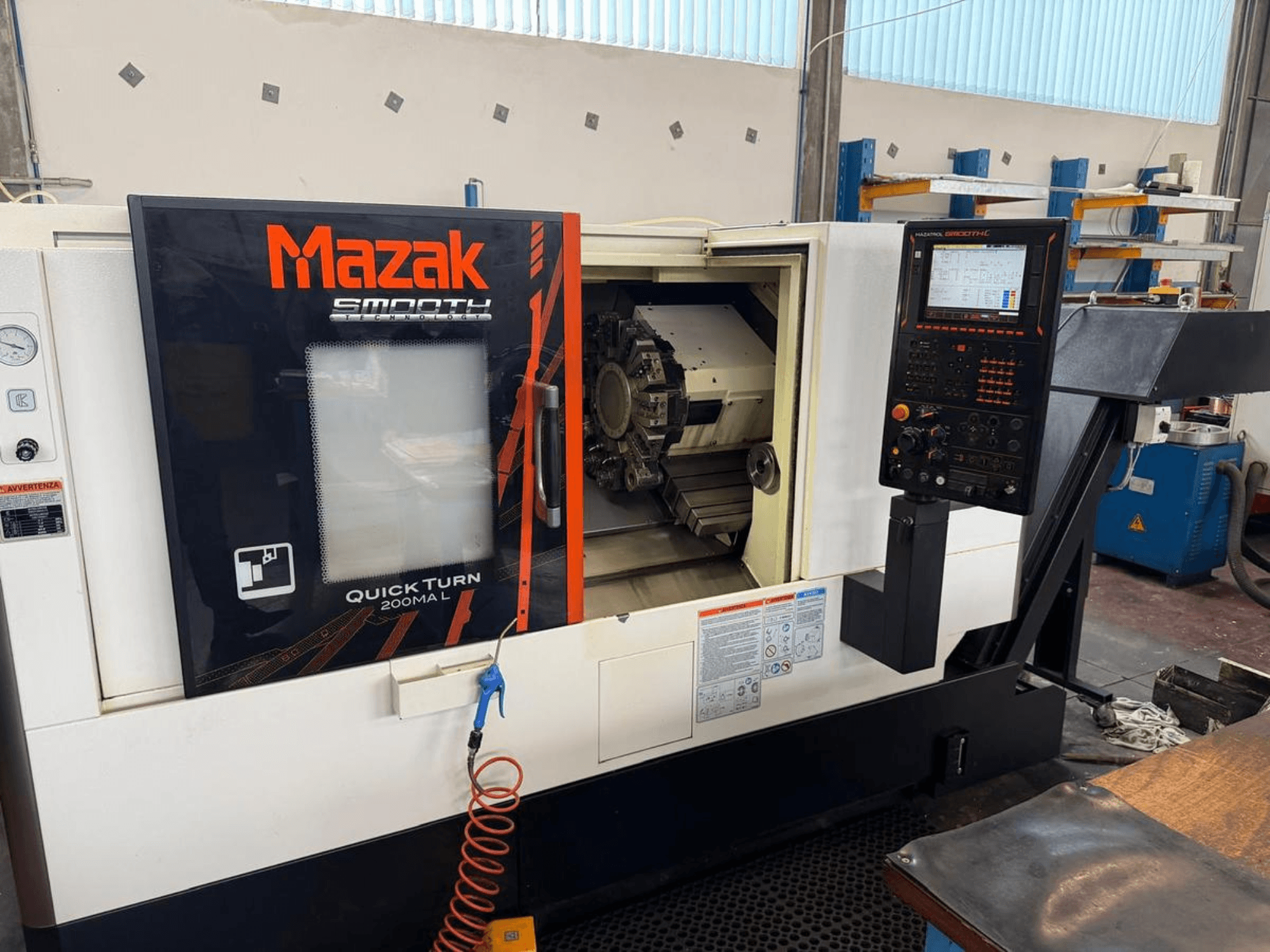 Mazak QUICK TURN 200MA L horizontal turning machine, front view showcasing control panel and machining chamber.