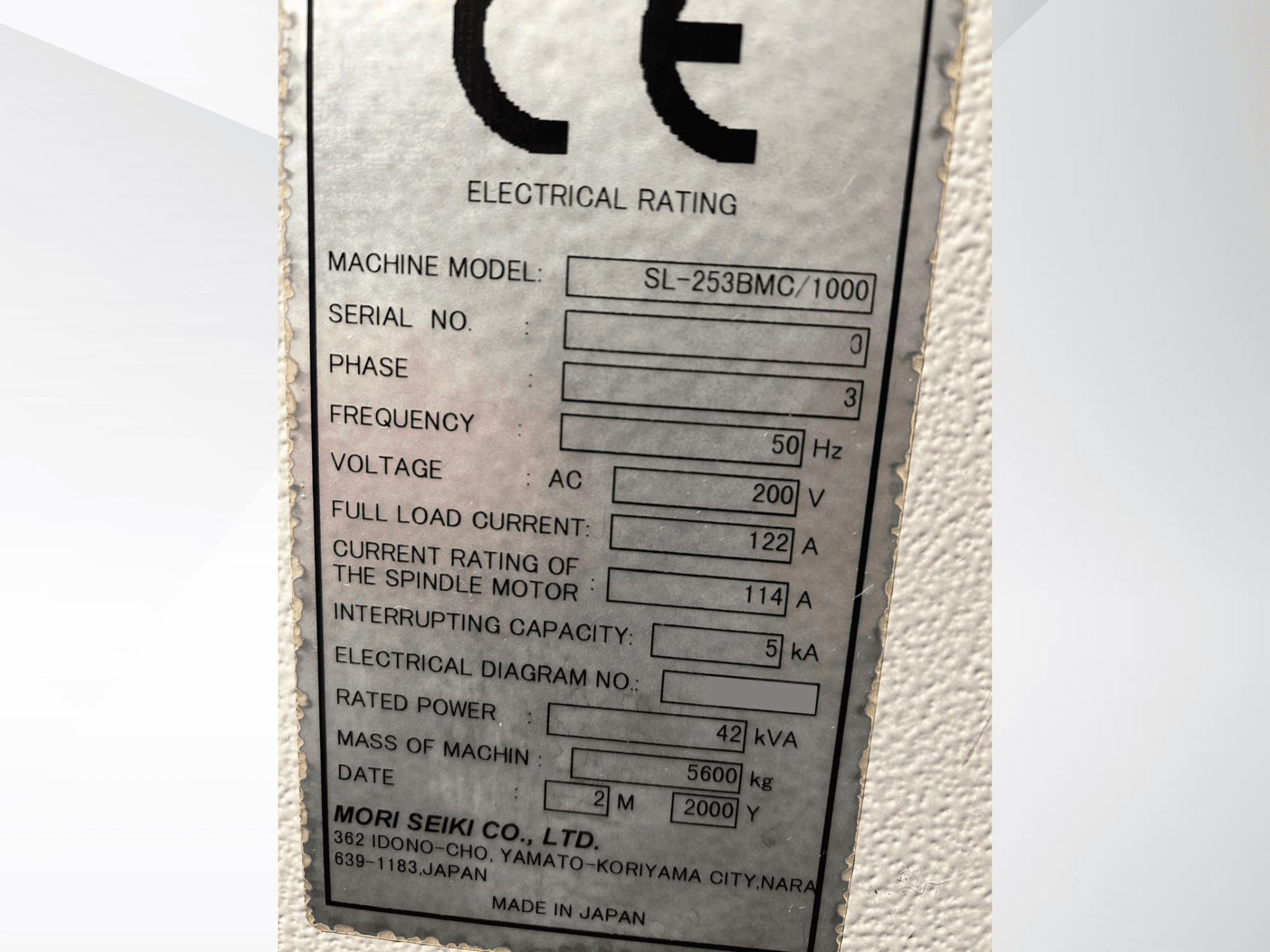 MORI SEIKI SL-253B MC/1000 electrical rating plate showing model, voltage, current, and power specifications. Side view angle.