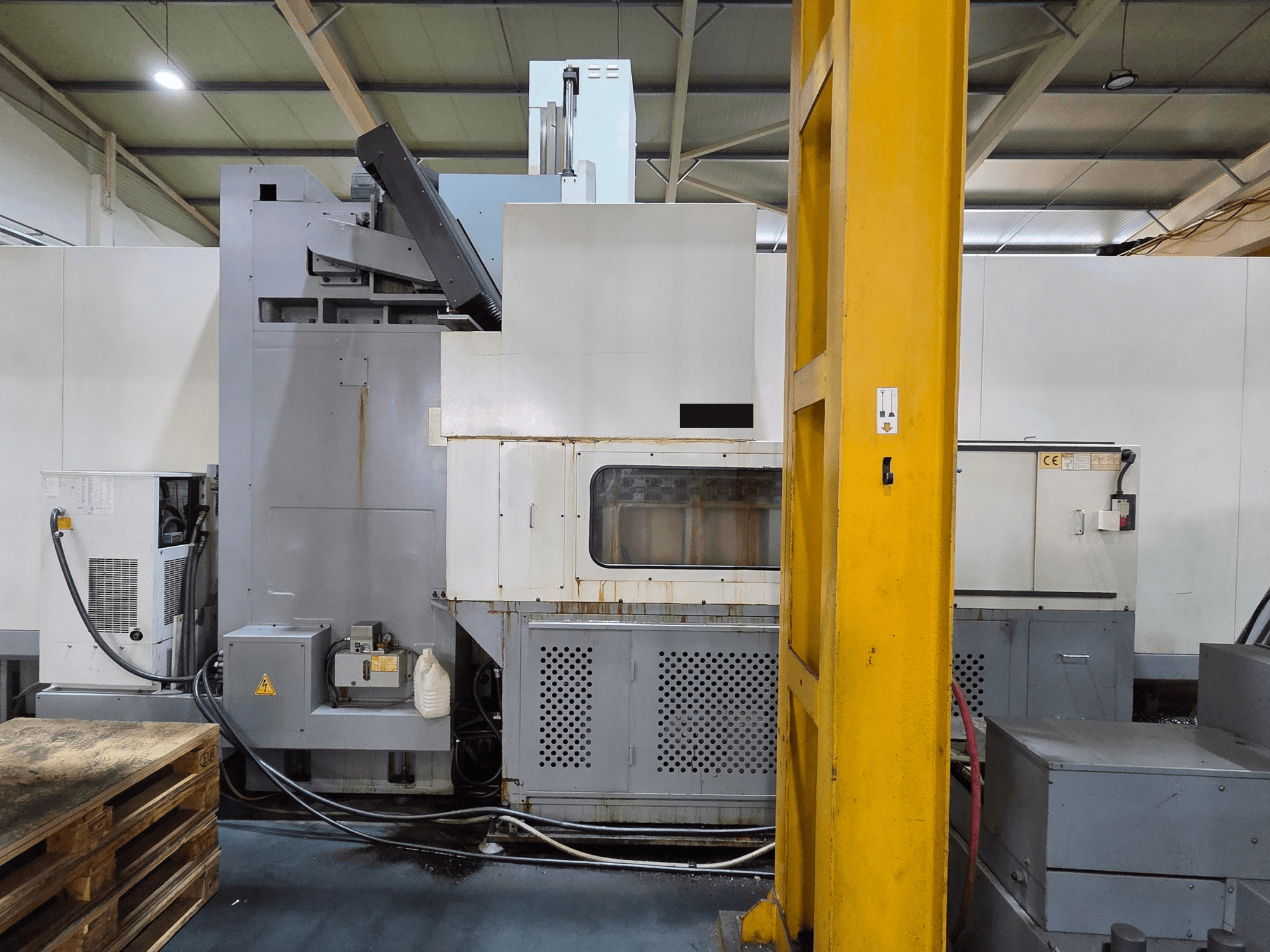 HARTFORD HB 3150/S vertical machining centre in a workshop, side view showing machine body and attached components.