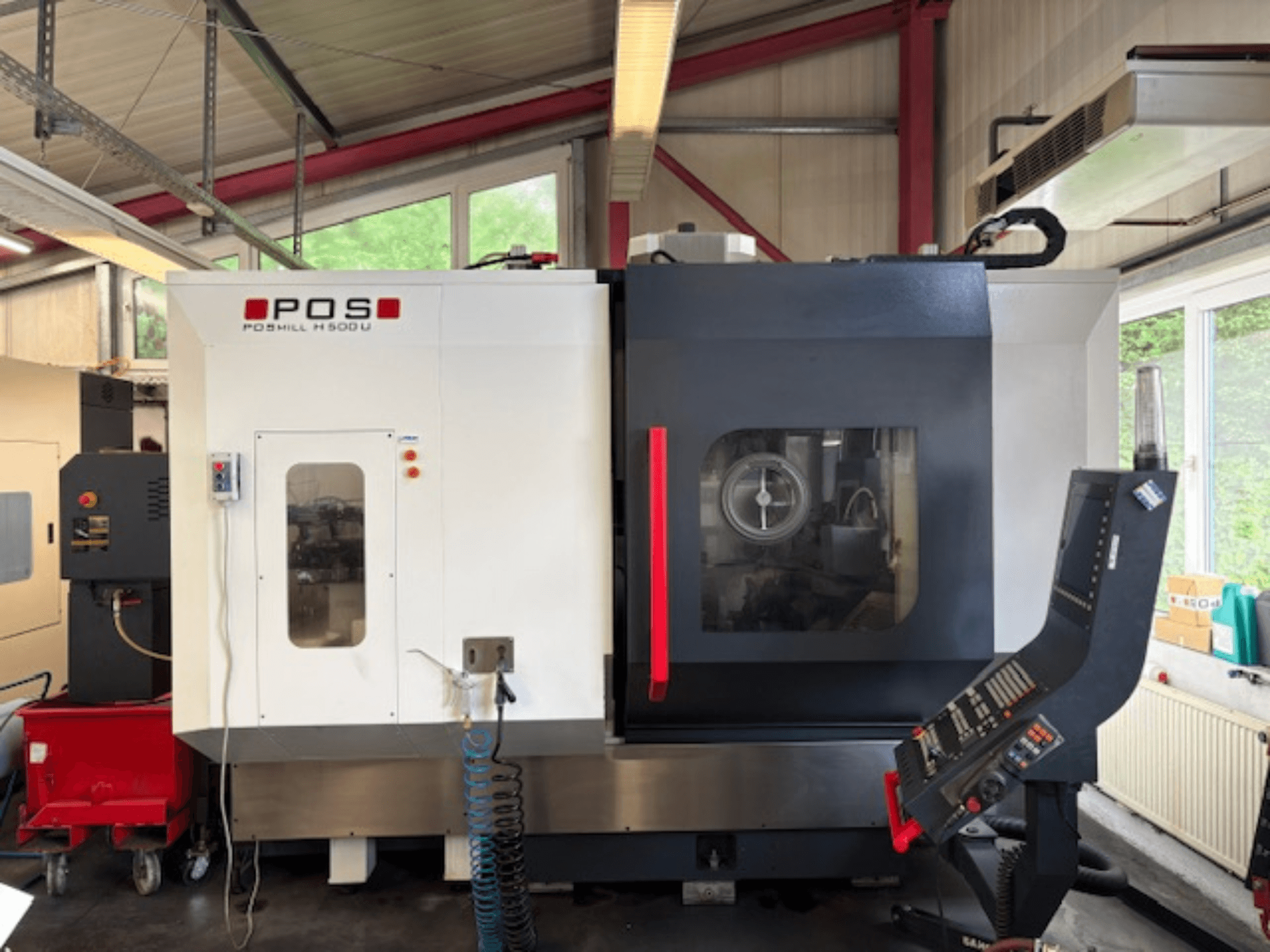 POS POMILL H500 U milling machine viewed from the front, featuring a control panel and operational window.