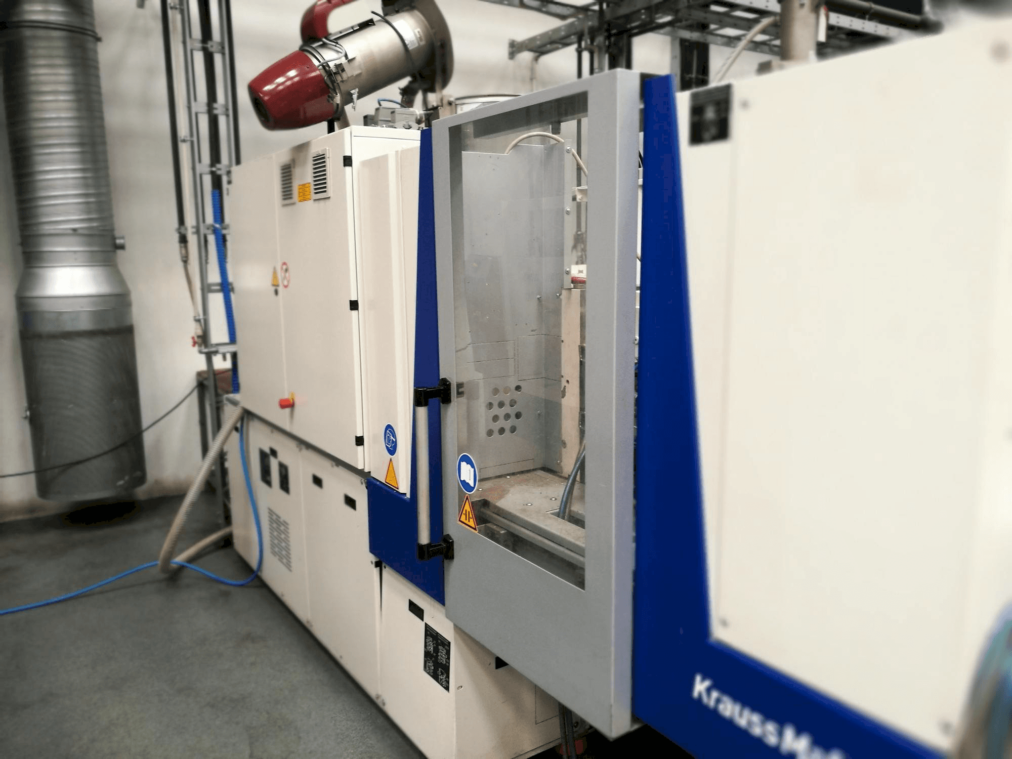 Front view of Krauss Maffei KM 35-55 CX machine