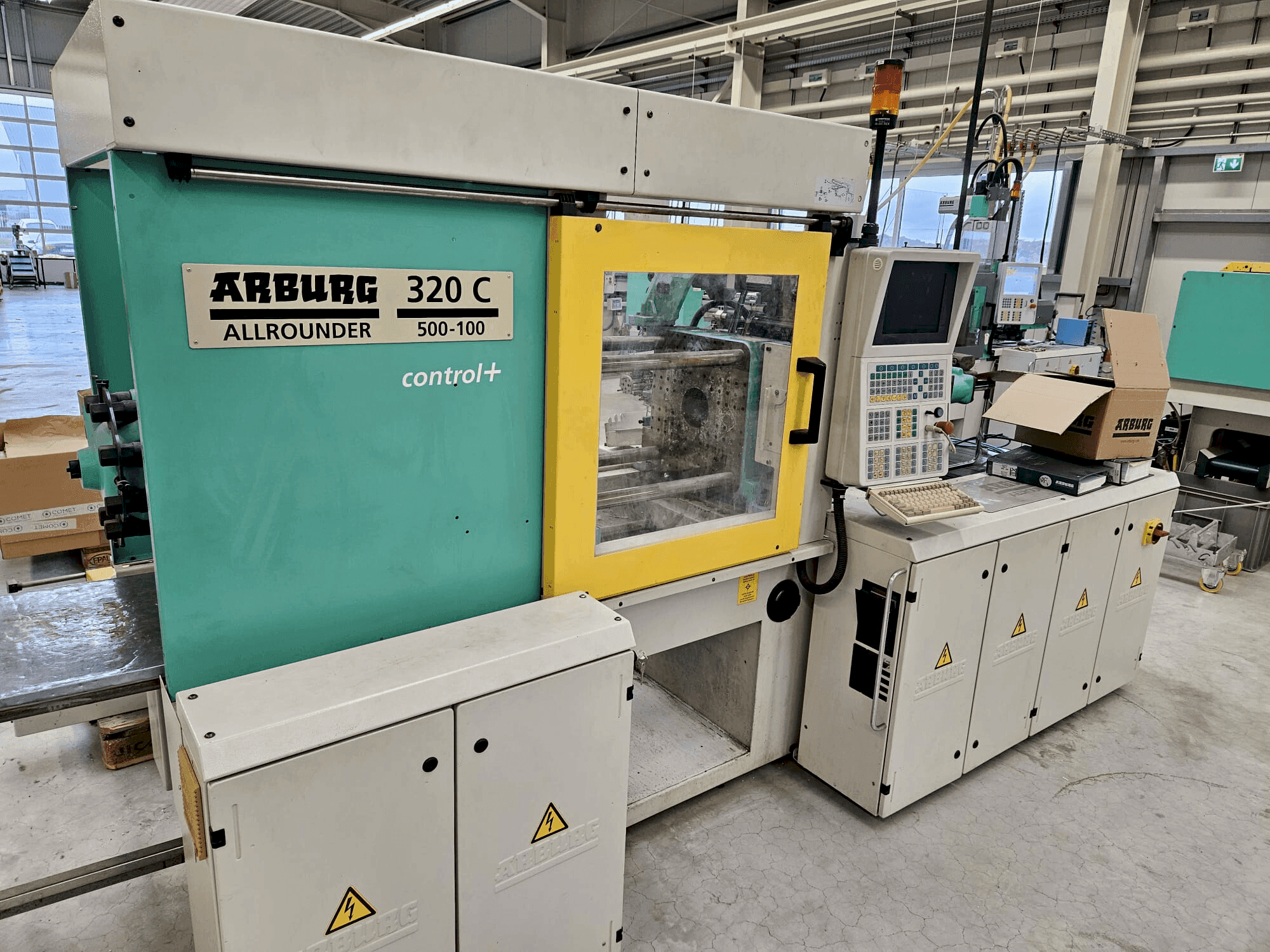 Front view of Arburg 320 C 500-100 + Multilift H with B-Axis machine