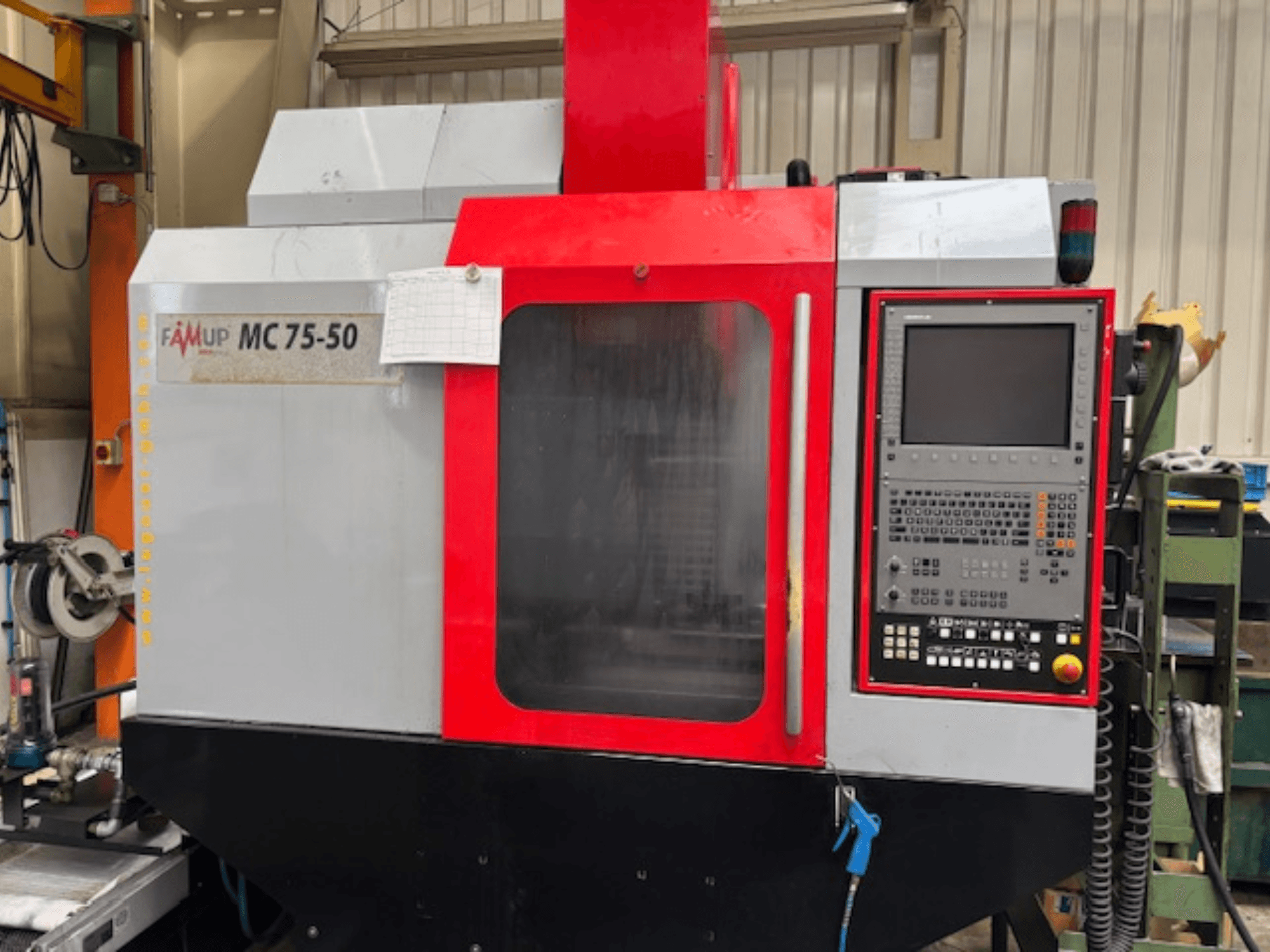 Vertical machining centre EMCO MC 75-50, front view, showcasing control panel and machine features.
